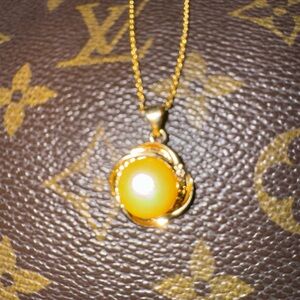 Genuine 11-12mm gold color South sea pearl pendant and gold plated necklace.
